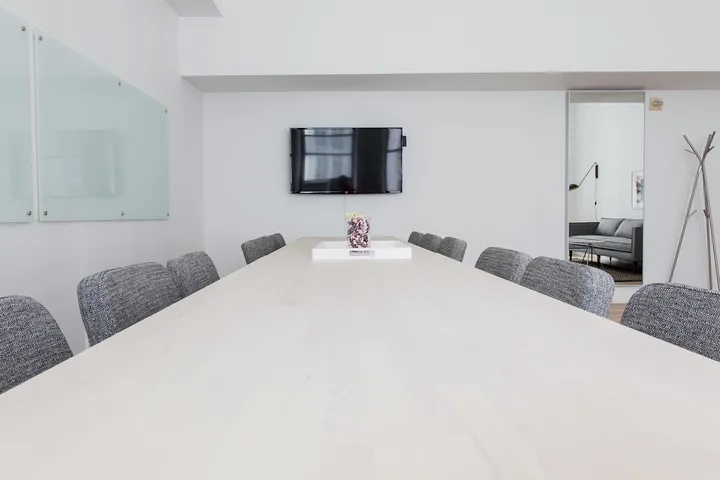 Executives meeting around a boardroom conference table