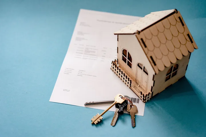 House keys resting on mortgage loan paperwork