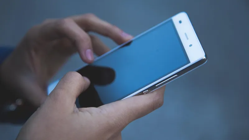 A credit union member using a secure mobile banking app on a smartphone